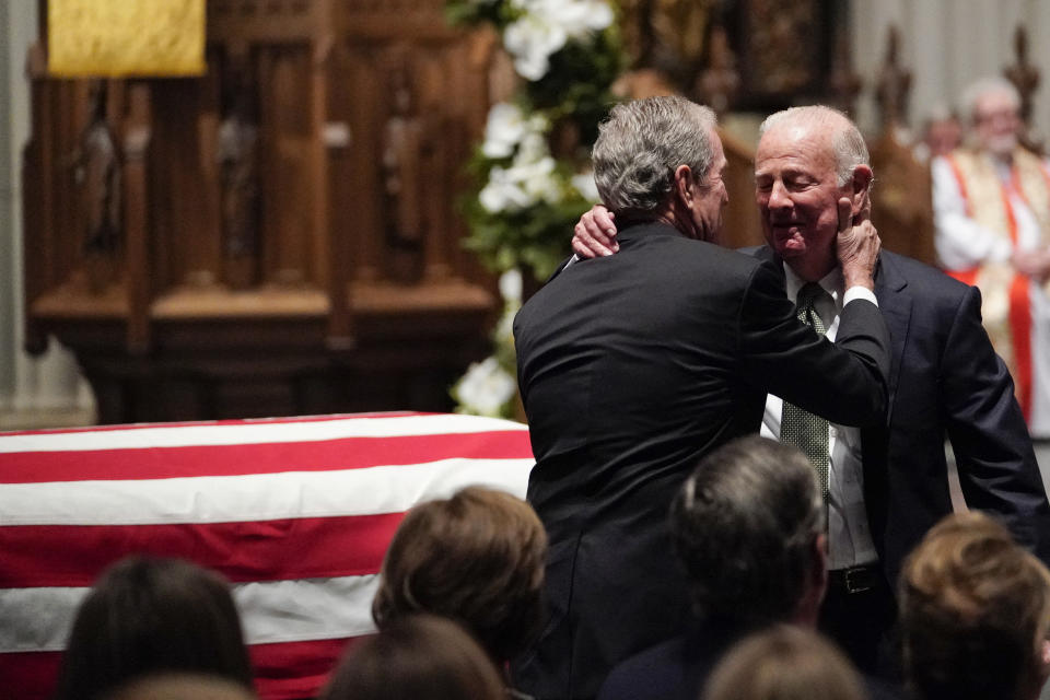 Former President George W. Bush embraces former Secretary of State James Baker, right, after he gave a eulogy during the funeral for former President George H.W. Bush at St. Martin’s Episcopal Church, Thursday, Dec. 6, 2018, in Houston. (Photo: David J. Phillip, Pool/AP)