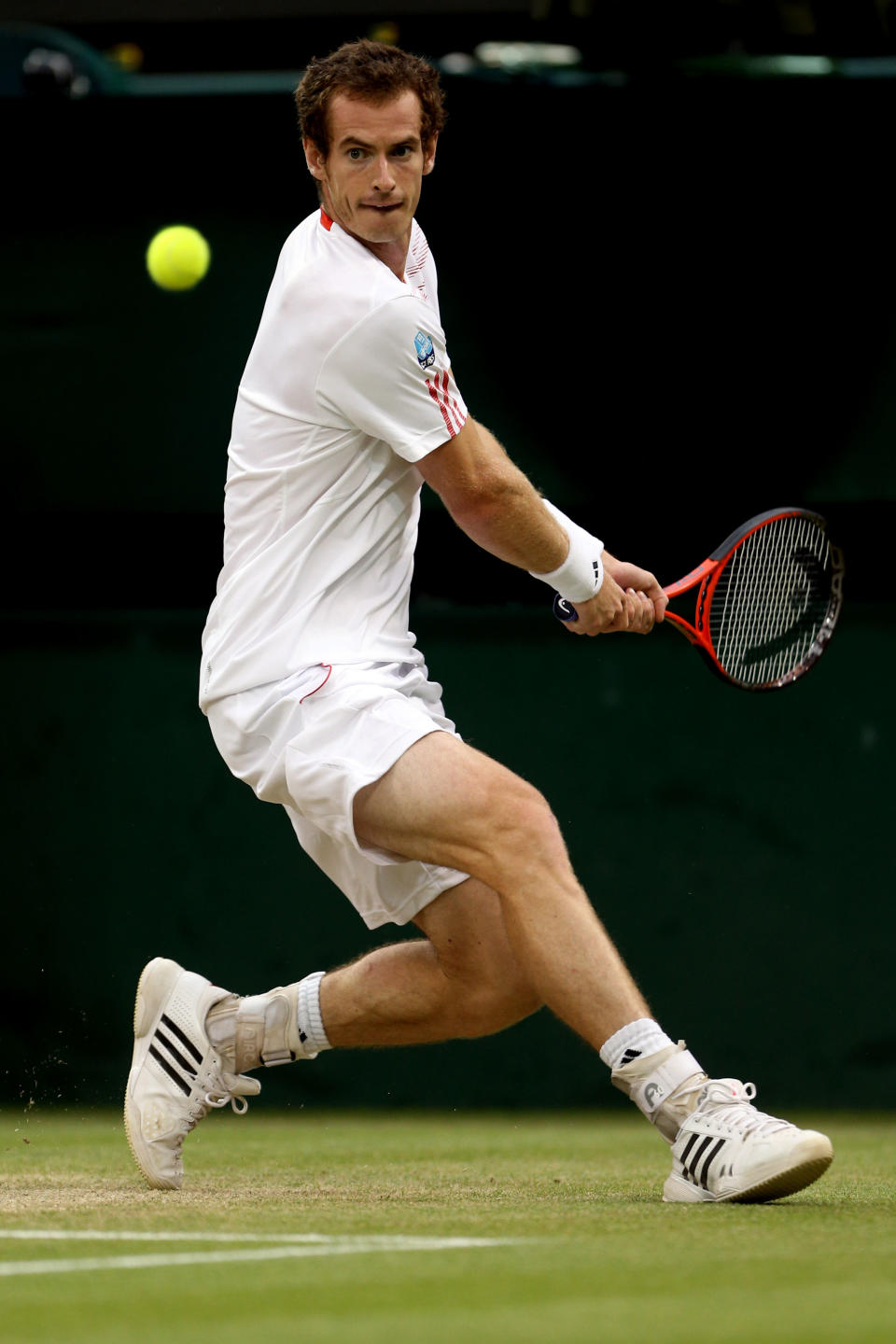 Andy Murray of Great Britain returns a shot during his Gentlemen's Singles final match against Roger Federer at Wimbledon.