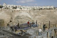 Palestinian labourers work on a construction site in the Israeli settlement of Maale Adumim, east of Jerusalem, on January 22, 2017
