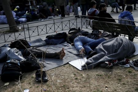 Migrants sleep on Victoria Square, where stranded refugees and migrants, most of them Afghans, find shelter in Athens, Greece, March 3, 2016. REUTERS/Alkis Konstantinidis