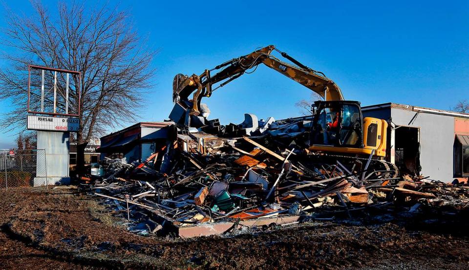 An excavator from TC Excavation of Hermiston, Ore., began demolishing a former restaurant building in Richland in January 2023 for a Panda Express and a second restaurant.