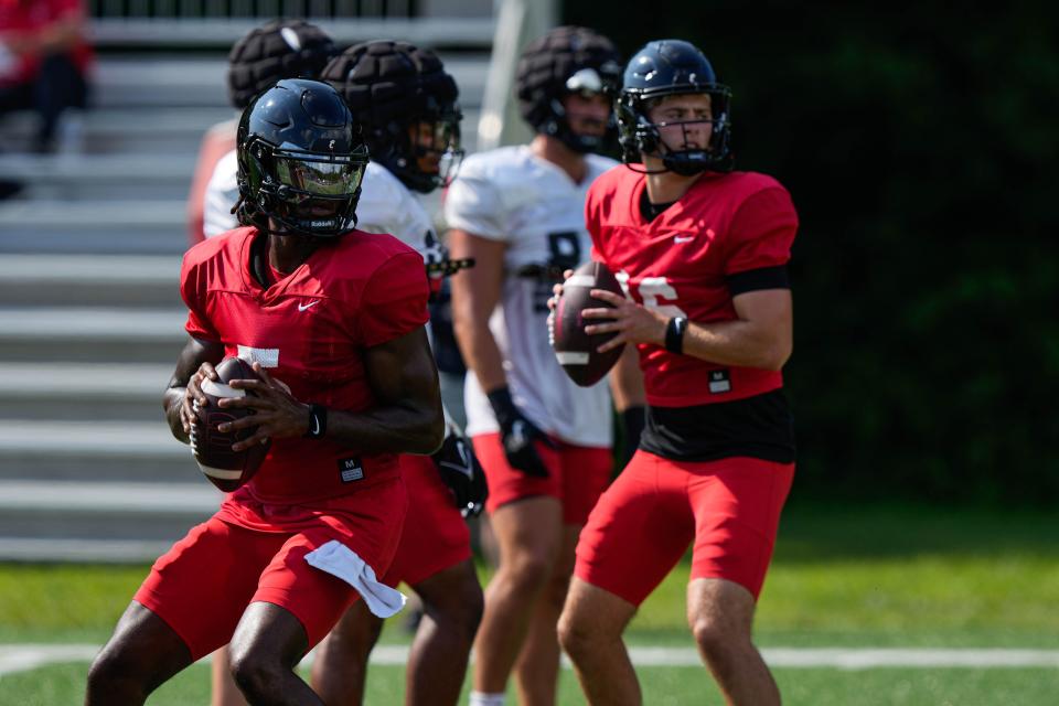 UC's Emory Jones (left) and Brady Lichtenberg train at the Bearcats Fall Camp at Higher Ground in Indiana on Friday August 11, 2023.