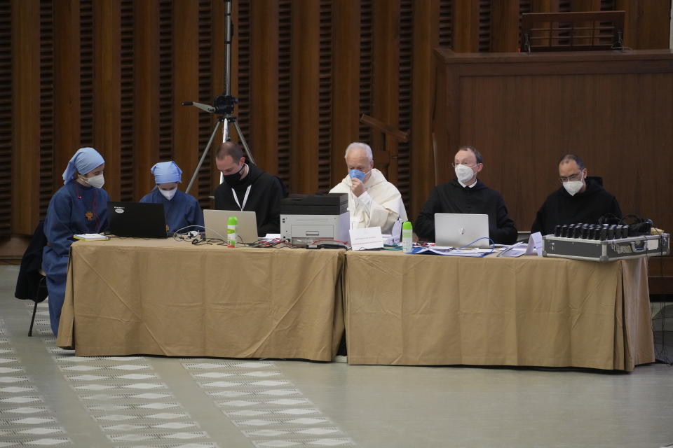 Nuns and priests attend the opening of a 3-day Symposium on Vocations in the Paul VI hall at the Vatican, Thursday, Feb. 17, 2022. (AP Photo/Gregorio Borgia)