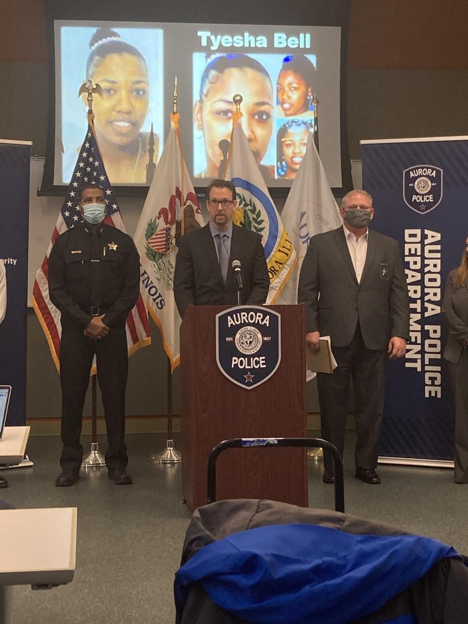 From left, Aurora Deputy Chief of Police Keith Cross, Aurora Police Cmdr. Jack Fichtel and Kane County Coroner Rob Russell face the media, Tuesday, March 16, 2021 in Aurora, Ill., as they announce that remains discovered in Kane County have been identified as those of Tyesha Bell, an Aurora woman missing since 2003. Illinois State Police’s crime lab identified Tyesha Bell’s remains through DNA analysis. (Denise Crosby/Chicago Tribune via AP)