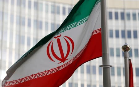 FILE PHOTO: The Iranian flag flutters in front the International Atomic Energy Agency (IAEA) headquarters in Vienna