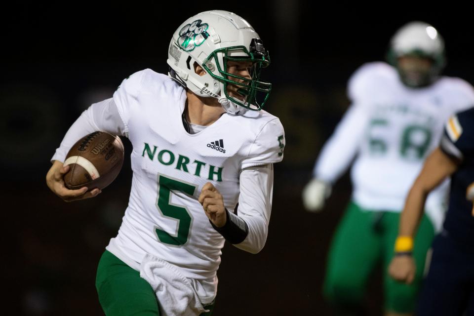 North’s Sam McKinney (5) runs the ball as the North Huskies play the Castle Knights in the IHSAA Class 5A sectional championship game at John Lidy Field in Newburgh, Ind., Friday, Nov. 4, 2022.