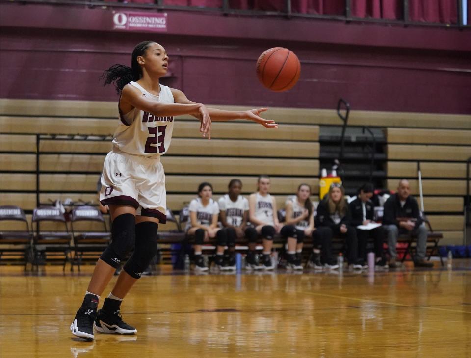Ossining's Saniya Bell (23) feeds a pass during basketball action against White Plains at Ossining High School on Friday, Jan. 19, 2024. Bell had 17 points in their 69-58 loss to White Plains.