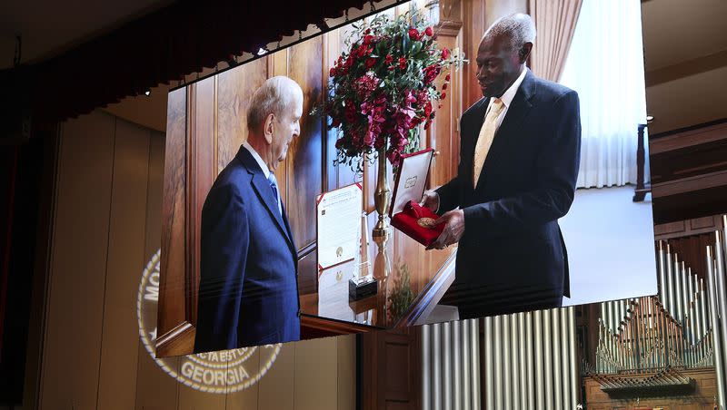 President Russell M. Nelson receives the Gandi-King-Mandela Peace Prize from Dr. Lawrence Edward Carter Sr., professor and founding dean of the Martin Luther King, Jr. International Chapel, at the annual Worldhouse Interfaith & Interdenominational Assembly at the Martin Luther King, Jr. International Chapel at Morehouse College in Atlanta, Georgia, on Thursday, April 13, 2023.