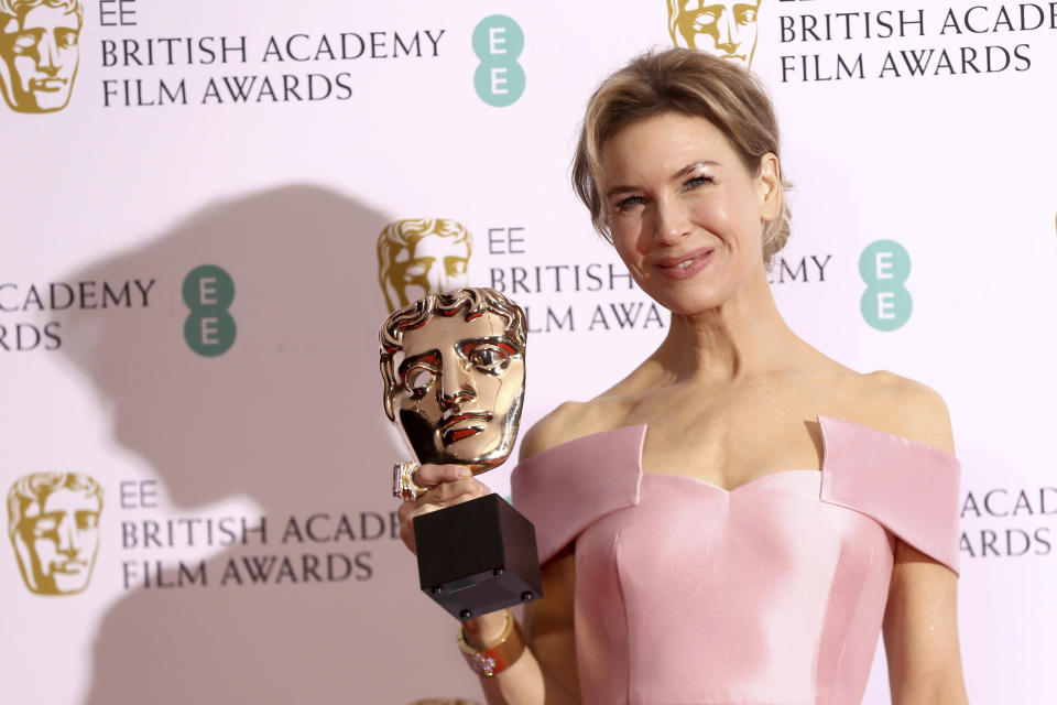 Actress Renee Zellweger poses with her award for Best Actress for Judy, backstage at the Bafta Film Awards, in central London, Sunday, Feb. 2, 2020. (Photo by Joel C Ryan/Invision/AP)