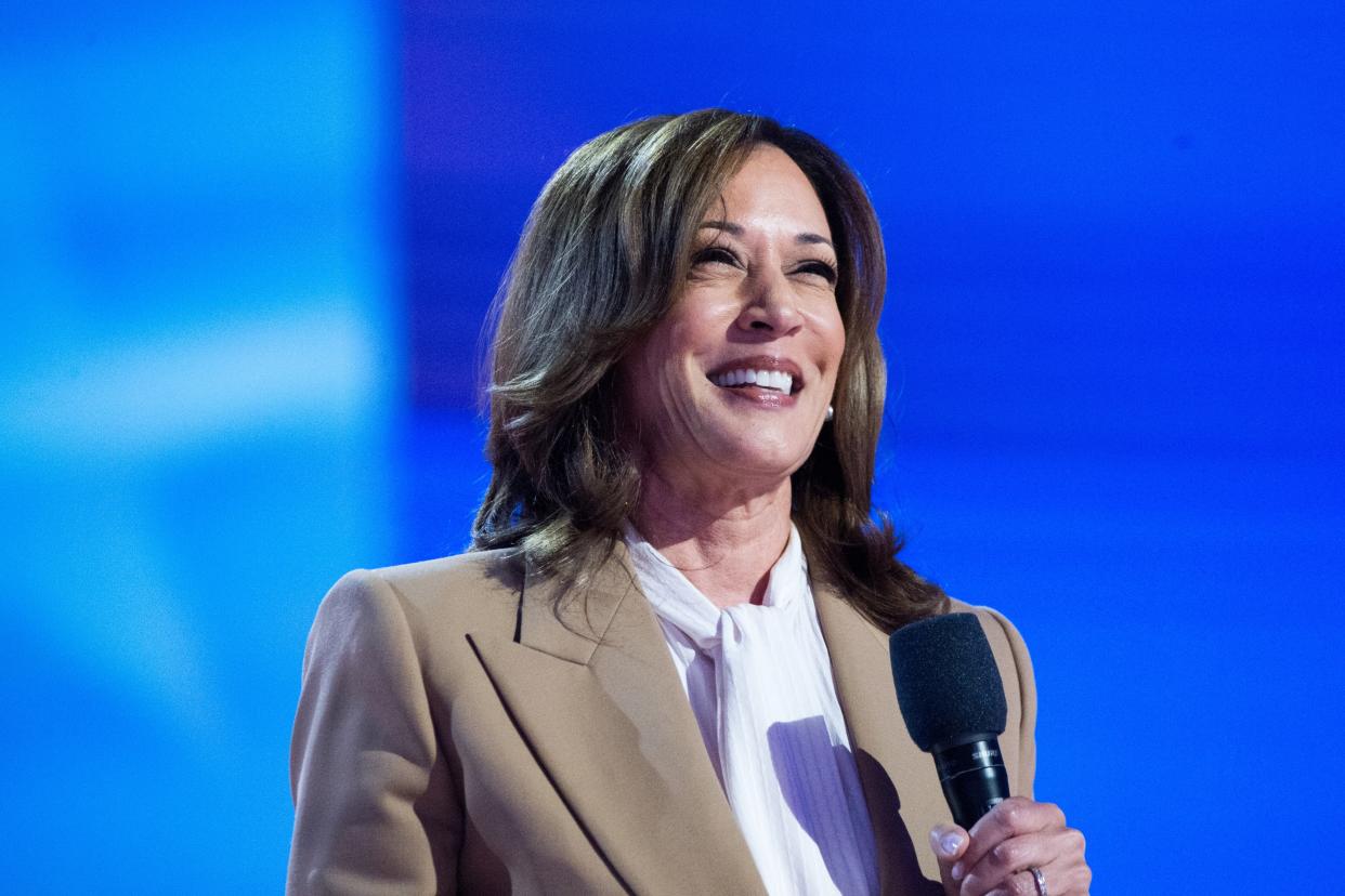  Vice President Kamala Harris, wearing a tan suit, speaks during the 2024 Democratic National Convention in Chicago.