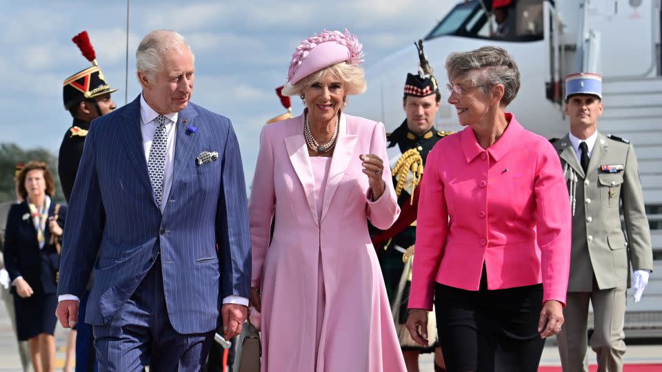 The royal couple were met upon arrival at Paris' Orly Airport by French Prime Minister Elisabeth Borne, right.  - Miguel Medina/Pool/Reuters