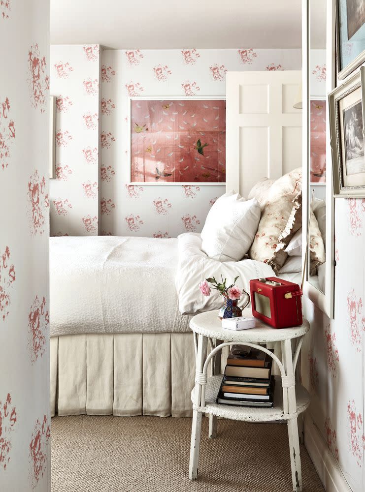 <p>This is the type of wallpaper that may seem intimidating close up, but includes enough plain space to not overwhelm a room. The cream tones used across walls, furniture, and woodwork here have been cleverly matched to create a subtle base against which even a smattering of pink will stand out.</p><p>For similar wallpaper, try <a href="https://designs.colefax.com/Search/W/Brand/C/Colour/All/Use/All/Category/All/SubType/F:All,T:All,W:All/New/0/Page/1/?bypass=true" rel="nofollow noopener" target="_blank" data-ylk="slk:Colefax & Fowler" class="link ">Colefax & Fowler</a></p>