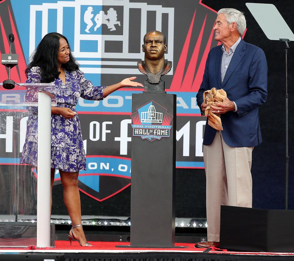 Sam Mills wife Melanie Mills and former coach Jim Mora Sr. react to the unveiling of his bust during the Pro Football Hall of Fame induction ceremony held at Tom Benson Hall of Fame Stadium in Canton Ohio, Saturday, August 6, 2022. 