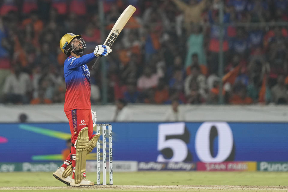 Royal Challengers Bengaluru's Rajat Patidar celebrates scoring fifty runs during the Indian Premier League cricket match between Royal Challengers Bengaluru and Sunrisers Hyderabad in Hyderabad, India, Thursday, April 25, 2024. (AP Photo/Mahesh Kumar A.)