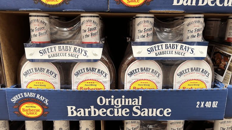 Two packs of Sweet Baby Ray's Honey Barbecue Sauce in Costco aisle
