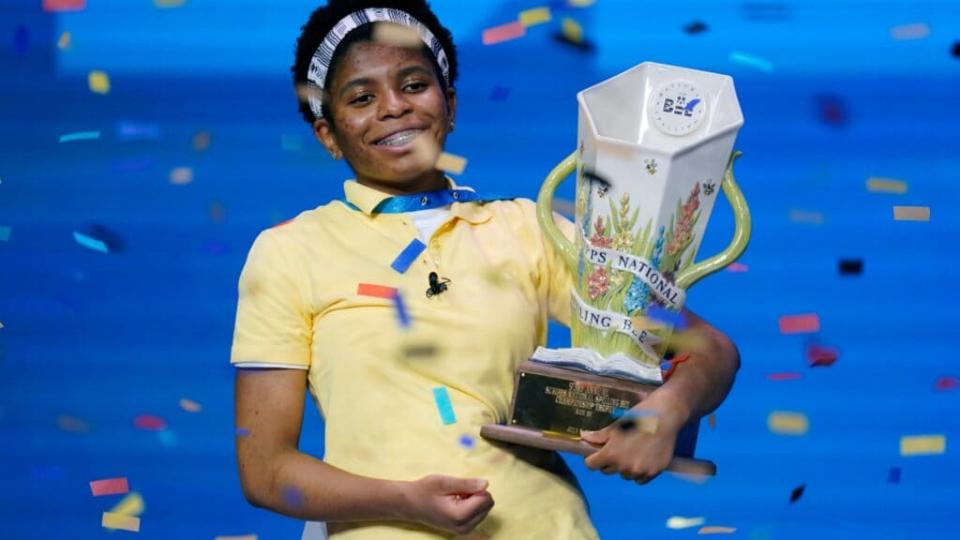 Zaila Avant-garde, 14, celebrates with the championship trophy after winning the finals of the 2021 Scripps National Spelling Bee at Disney World Thursday. (AP Photo/John Raoux)