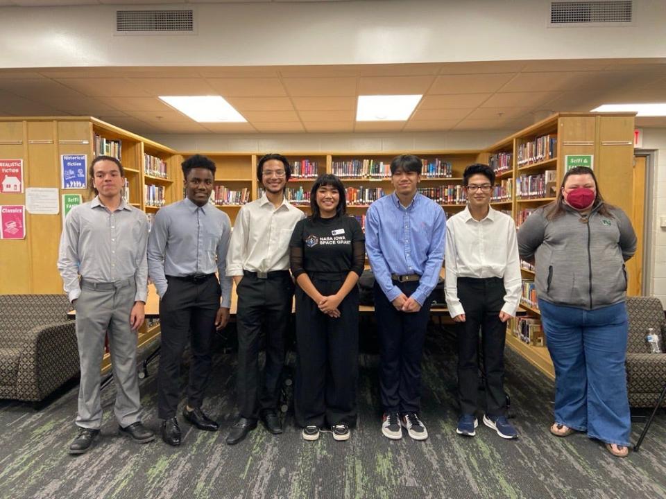 Rachel Shannon and Jessi Nunes pose with Frostbyte members after their presentation. From left to right, Jefery Allen, Champ-Pacifique Mukiza, Sujal Pokhrel, Rachel Shannon, Moss Louvan, Romas Pokhrel and Jessi Shannon.