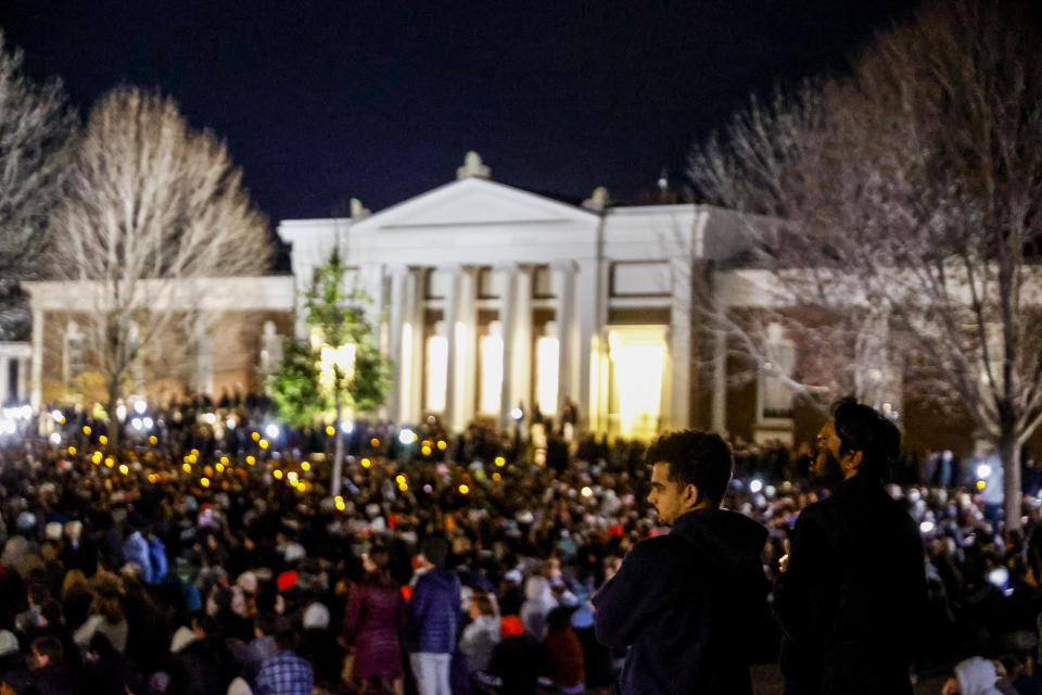 Students and community members gather for a candlelight vigil after a shooting that left three students dead the night before at the University of Virginia, Monday, Nov. 14, 2022, in Charlottesville, Va. (Shaban Athuman/Richmond Times-Dispatch via AP)