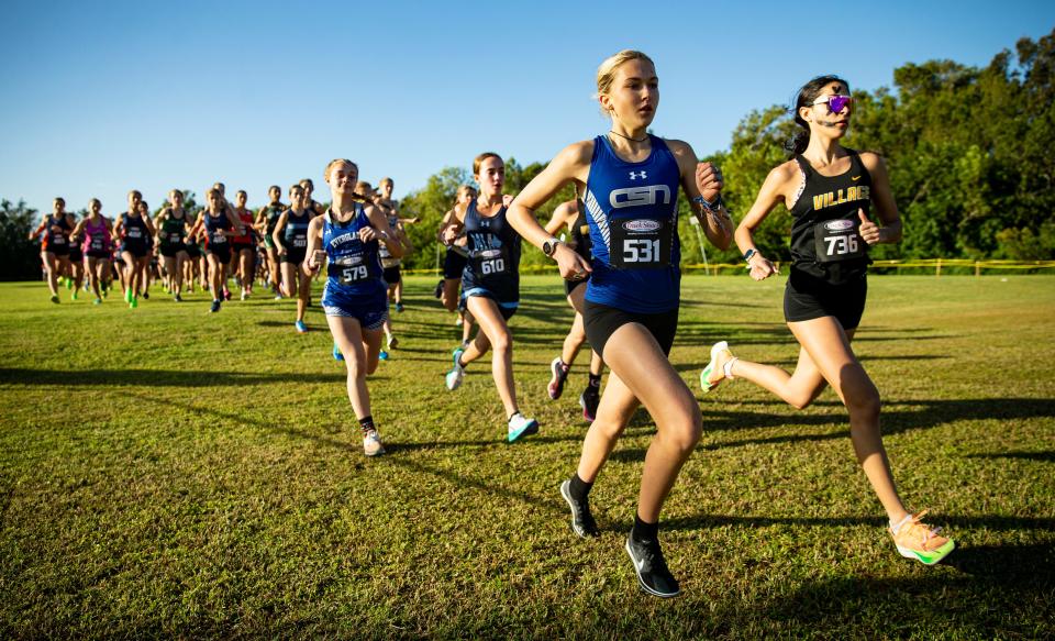 Sienna Audrey, front left, from the Community School of Naples leads the FHSAA 1A District 6 Cross Country meet at Southwest Florida Christian Academy in Fort Myers on Thursday, Nov. 2, 2023. She won. Community School of Naples girls also won as a team.