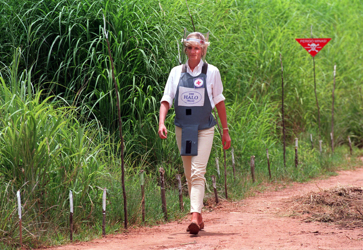 File photo dated 15/01/97 of Diana, Princess of Wales wearing a bombproof visor during her visit to a minefield in Huambo, in Angola. The Duke of Sussex has donned body armour and a protective visor to walk through a partially cleared minefield during a visit to the Halo Trust in Dirico, Angola, in scenes reminiscent of his mother Diana, on day five of the royal tour of Africa.  [Photo: PA]