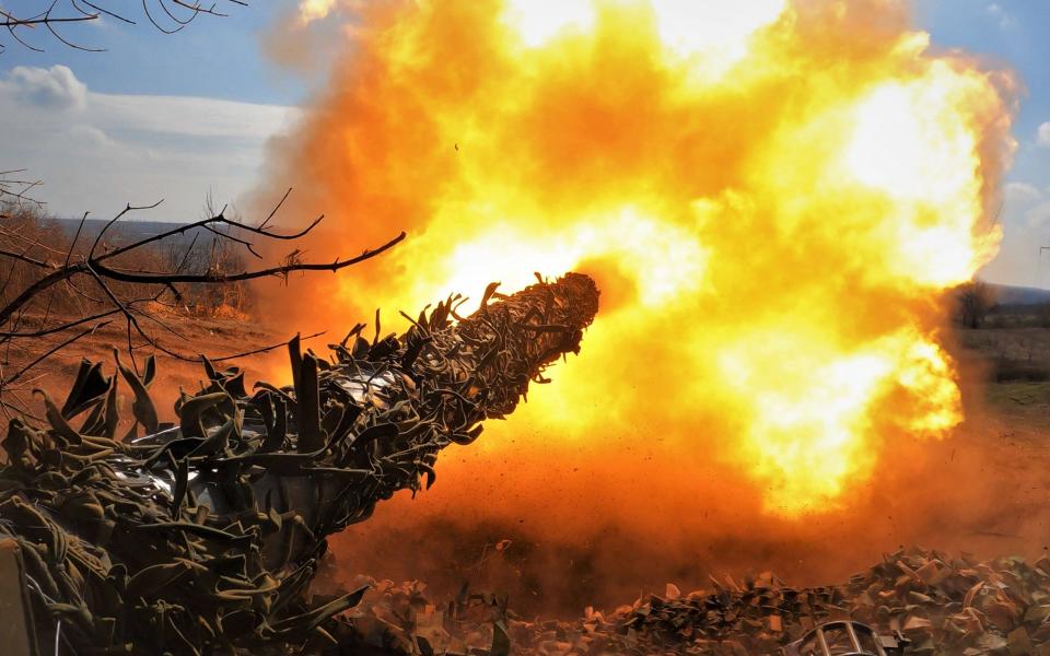 A Ukrainian T-72 tank fires at Russian positions on the front line near Bakhmut - SERGEY SHESTAK/AFP