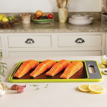 This four-in-one chopping board thaws food, and acts as a knife sharpener and a spice grinder