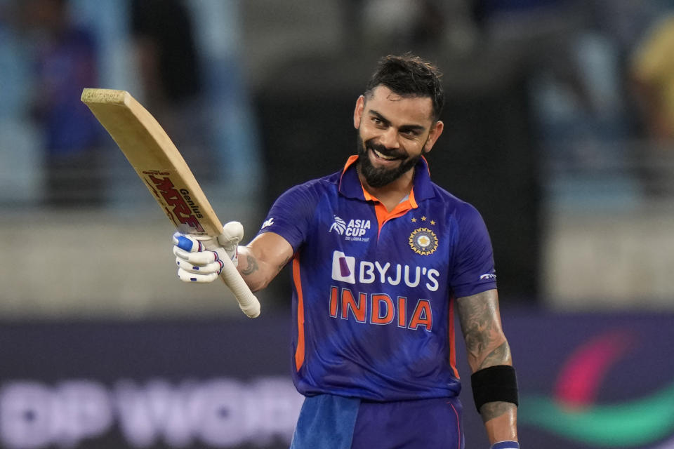 India's Virat Kohli raises his bat to celebrate scoring a century during the T20 cricket match of Asia Cup between India and Afghanistan, in Dubai, United Arab Emirates, Thursday, Sept. 8, 2022. (AP Photo/Anjum Naveed)