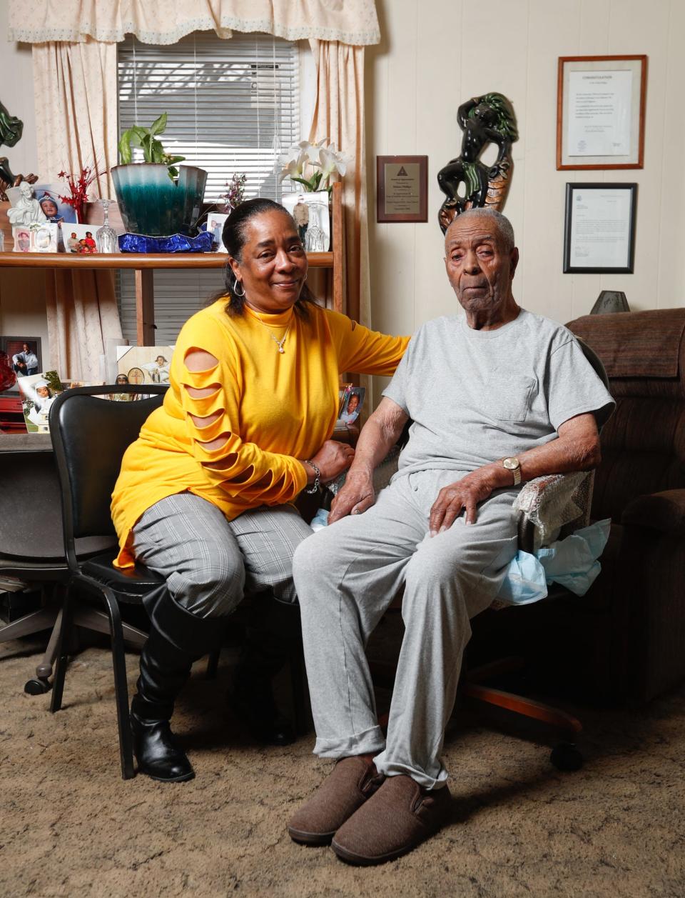 Alesha Holder, 58 and her great grandfather Hobart Phillips, who turns 102 on March 6th, are photographed on Wednesday, March 2, 2022, in their home in Norwood neighborhood of Indianapolis. Phillips parents built their home in the 1920's. The Norwood neighborhood was a Freetown built by Civil War veterans.