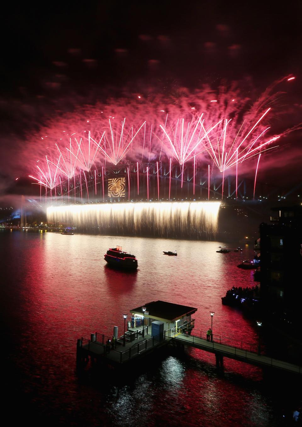 Fireworks light up the sky above the Sydney Harbour Bridge at midnight during New Years Eve celebrations on Sydney Harbour on December 31, 2012 in Sydney, Australia. (Cameron Spencer/Getty Images)