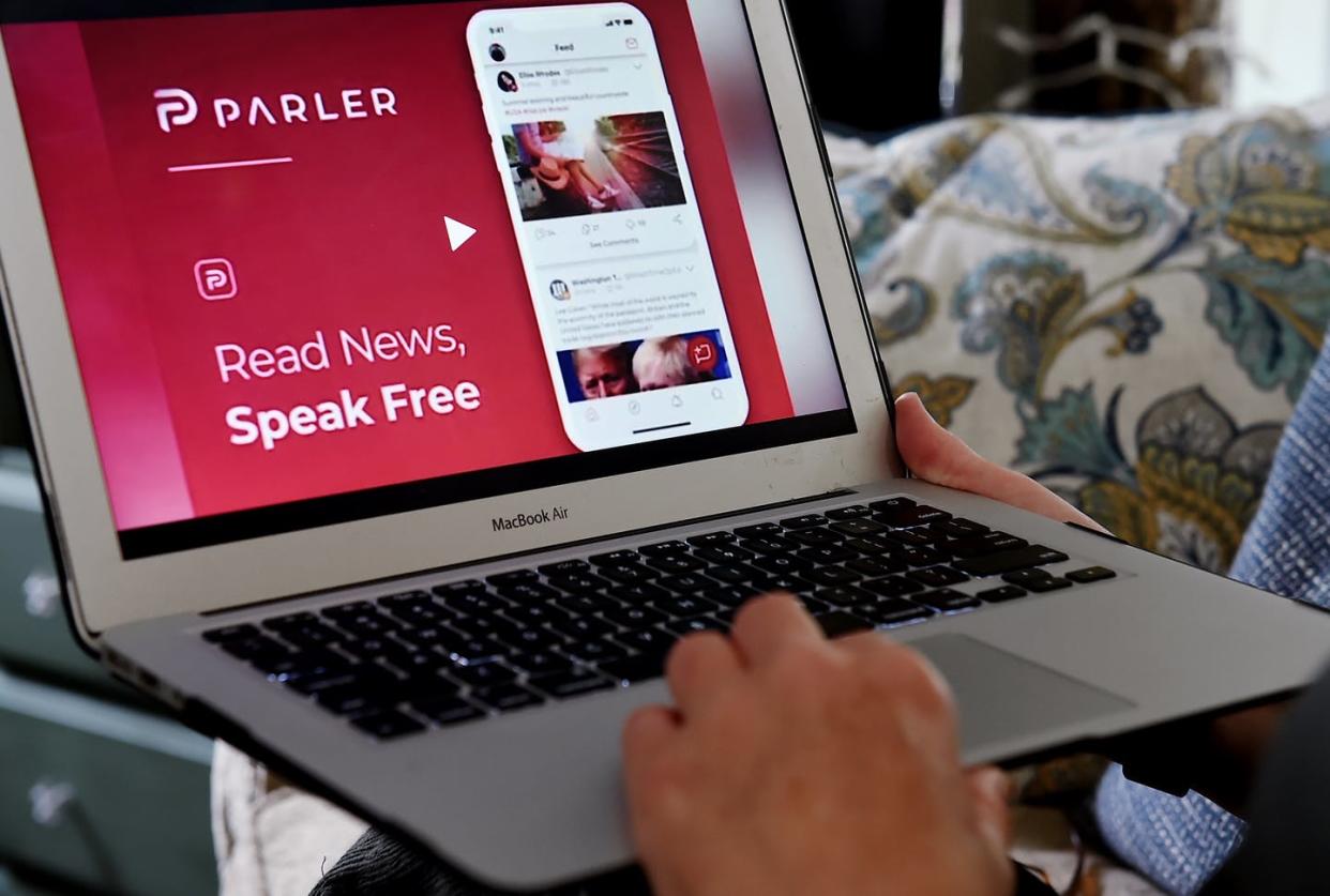 <span class="caption">Parler is similar to Twitter but doesn't control or discourage hate speech or calls to violence.</span> <span class="attribution"><a class="link " href="https://www.gettyimages.com/detail/news-photo/this-illustration-picture-shows-the-social-media-website-news-photo/1225872887?adppopup=true" rel="nofollow noopener" target="_blank" data-ylk="slk:OLIVIER DOULIERY/AFP via Getty Image;elm:context_link;itc:0;sec:content-canvas">OLIVIER DOULIERY/AFP via Getty Image</a></span>