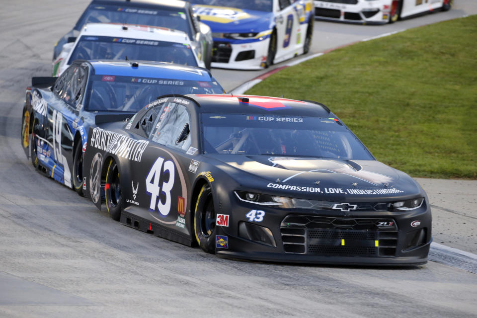 Bubba Wallace (43) drives during a NASCAR Cup Series auto race Wednesday, June 10, 2020, in Martinsville, Va. (AP Photo/Steve Helber)