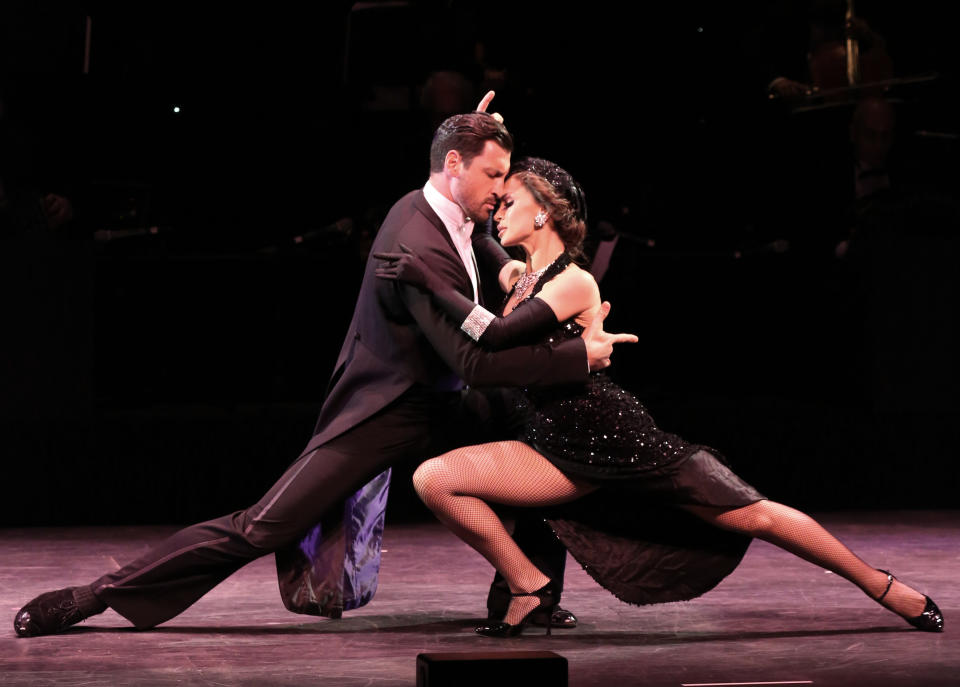 In this July 11, 2013 photo released by The O + M Company, Maksim Chmerkovskiy, left, and Karina Smirnoff perform during "Forever Tango" at the Walter Kerr Theatre in New York. (AP Photo/The O + M Company, Walter McBride)