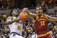 Missouri's Kobe Brown, left, and Iowa State's Robert Jones, right, battle for a rebound during the first half of an NCAA college basketball game, Saturday, Jan. 28, 2023, in Columbia, Mo. (AP Photo/L.G. Patterson)