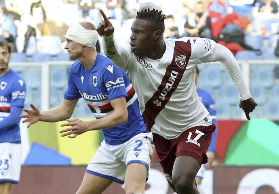 Torino’s Wilfried Singo, right, celebrates after scoring against Sampdoria.