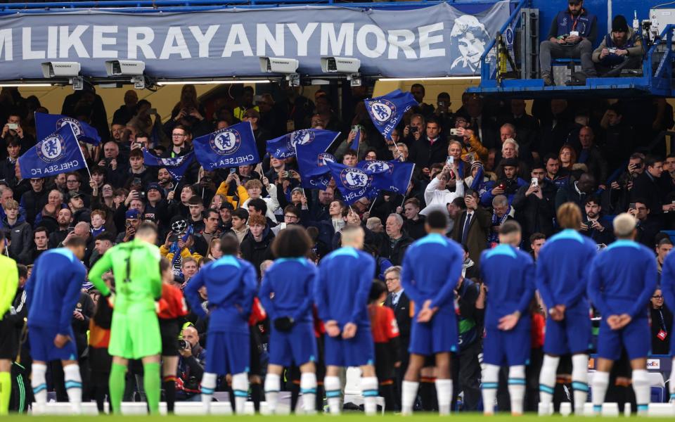 Fans wave flags as Chelsea line up during the UEFA Champions League quarterfinal second leg match between Chelsea FC and Real Madrid at Stamford Bridge on April 18, 2023 in London, United Kingdom - Getty Images/ Jacques Feeney