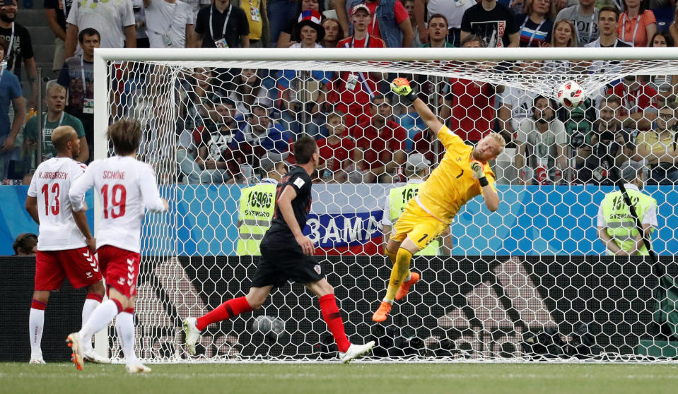 <p>Denmark’s Kasper Schmeichel watches as the ball goes over the bar </p>