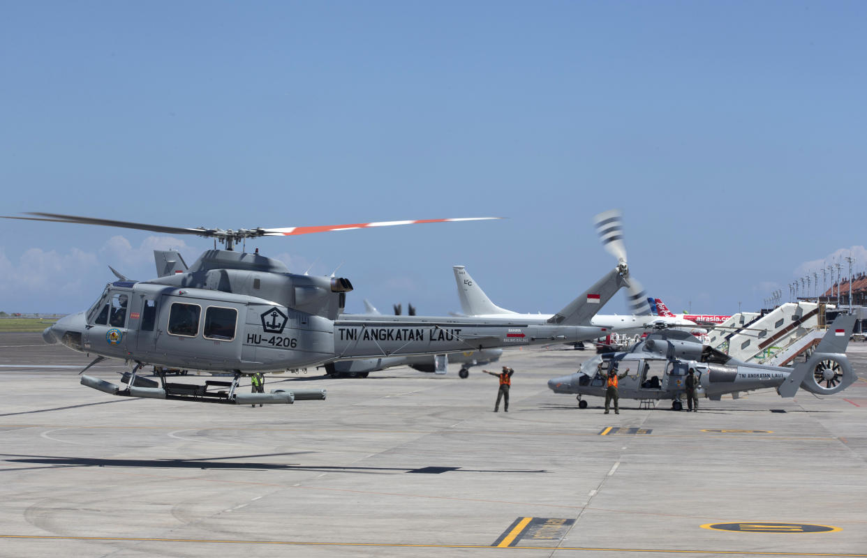 A navy helicopter with Indonesian Military chief Hadi Tjahjanto onboard, takes off during a search mission for The Indonesian Navy submarine KRI Nanggala at Ngurah Rai Military Air Base in Bali, Indonesia on Saturday, April 24, 2021. The oxygen supply for the crew members of the Indonesian submarine missing in waters off Bali is believed to have run out early Saturday with no sign of the vessel while the search resumed, bolstered by the arrival of a sonar-equipped Australian warship. (AP Photo/Firdia Lisnawati)