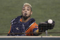 Houston Astros' Martín Maldonado can't catch a foul ball hit by Oakland Athletics' Mark Canha during the seventh inning of a baseball game in Oakland, Calif., Wednesday, Sept. 9, 2020. (AP Photo/Jed Jacobsohn)