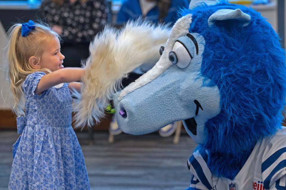 Stella Steichen plays with the Indianapolis Colts mascot, Blue, while her father, Shane Steichen speaks at a press conference Tuesday, Feb. 14, 2023 announcing that he is the new Indianapolis Colts Head Coach. Colts Owner and CEO Jim Irsay and General Manager Chris Ballard introduced the new coach in the Gridiron Hall of the Indiana Farm Bureau Football Center.