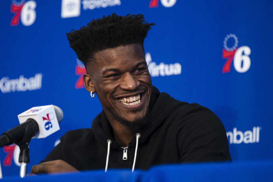 FILE - In this Nov. 13, 2018 file photo Philadelphia 76ers' Jimmy Butler speaks with members of the media during a news conference at the NBA basketball team's practice facility in Camden, N.J. There is no more doubt about Butler's future. The Miami Heat completed agreements on what will become a four-team trade Monday, July 1, 2019 to land Butler from the 76ers, with the Los Angeles Clippers and Portland Trail Blazers also involved. (AP Photo/Matt Rourke, file)