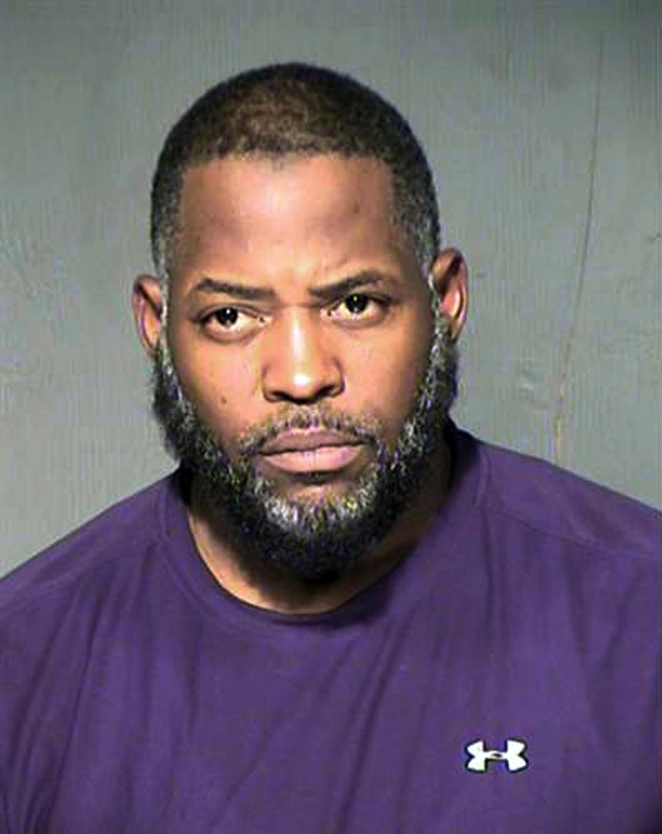 FILE - This undated file photo provided by the Maricopa County Sheriff's Department shows Abdul Malik Abdul Kareem. A federal judge refused to toss out the entire case against Kareem convicted of providing guns to and training two friends who attacked a Prophet Muhammad cartoon contest outside Dallas, but said this week he should be retried on a single count of transporting weapons across state lines. (Maricopa County Sheriff's Department via AP, File)