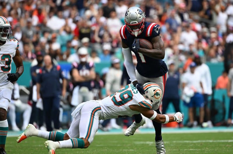 Miami Dolphins safety Brandon Jones (L) attempts to tackle New England Patriots wide receiver DeVante Parker on Sunday at Hard Rock Stadium in Miami Gardens, Fla. Photo by Larry Marano/UPI