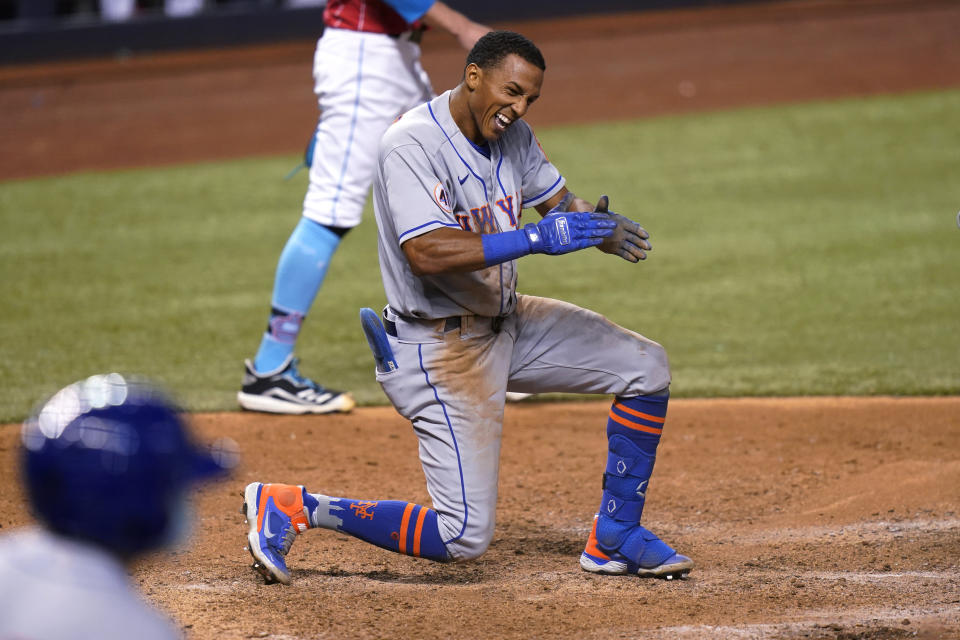 New York Mets' Johneshwy Fargas reacts after he was out at the plate during the 12th inning of the team's baseball game against the Miami Marlins, Friday, May 21, 2021, in Miami. The Mets won 6-5 in 12 innings. (AP Photo/Lynne Sladky)