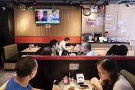 <p>At a restaurant in Hong Kong, a TV screen shows President Trump and North Korea leader Kim Jong Un on Tuesday. (Photo: Miguel Candela/SOPA Images/LightRocket via Getty Images) </p>