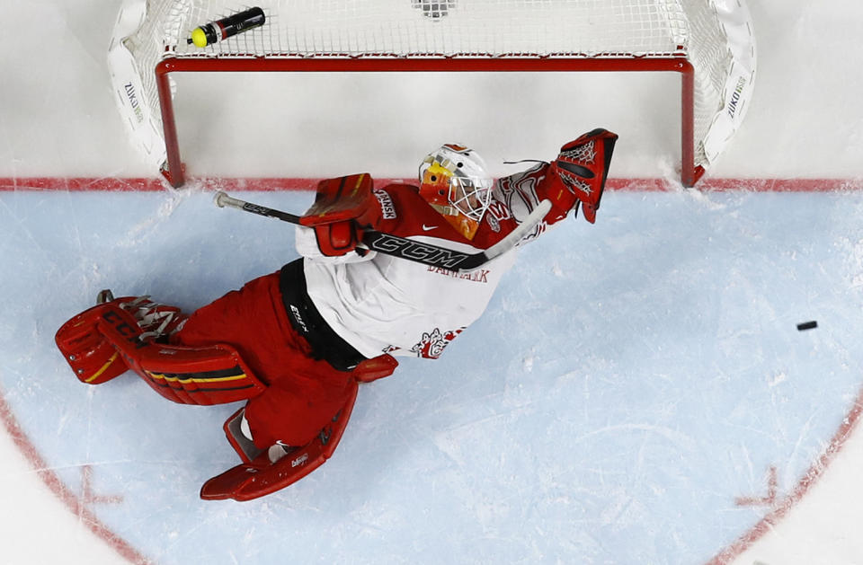 <p>George Sorensen of Denmark defends the goal during a 2017 IIHF World Championship group A game against Sweden in Cologne, Germany, May 14, 2017. (Photo: Wolfgang Rattay/Reuters) </p>