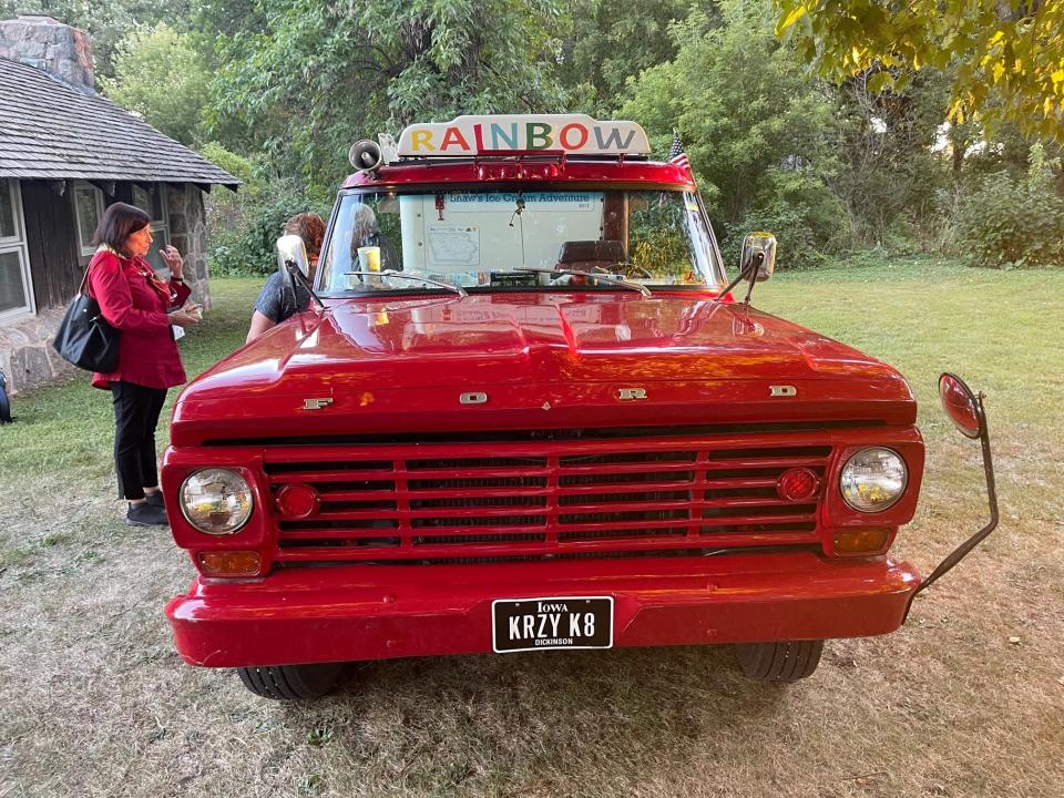 Bob and Kate Shaw of Spirit Lake, Iowa talk with a patron at a potluck dinner during the Okoboji Writers Retreat at the Iowa Lakeside Laboratory in mid-September. The Shaws have sold ice cream from their 1967 Ford F-250 for decades.