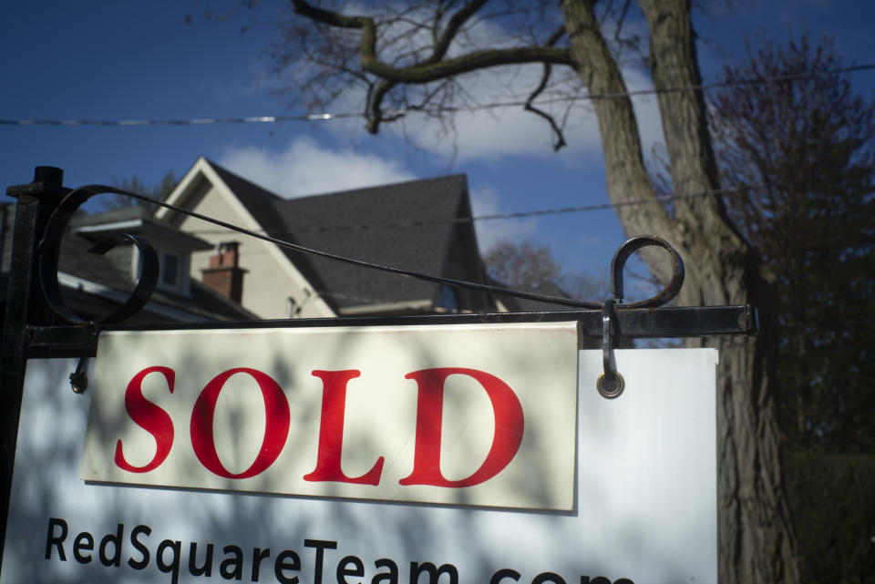 Greater Toronto home sales soared 37 per cent last month compared with the same month a year ago as lower borrowing costs associated with fixed-rate mortgages lured some buyers back to the market. A real estate sold sign is shown in a Toronto west end neighbourhood May 16, 2020. THE CANADIAN PRESS/Graeme Roy