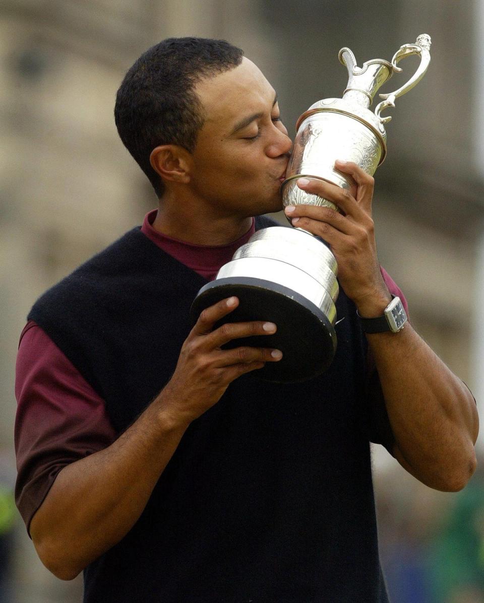 Tiger Woods kissed the Claret Jug after winning the 134th Open Championship at St Andrews (Gareth Fuller/PA) (PA Archive)