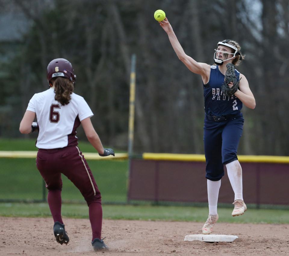 Brighton shortstop Nora Smith (2), right, steps on second for the force out of Mendon's Madeline Fallows, and makes a leaping throw to first but not in time to turn the double play in the sixth inning during their Section V matchup Monday, April 11, 2022 at Thornell Farm Park in Pittsford. 