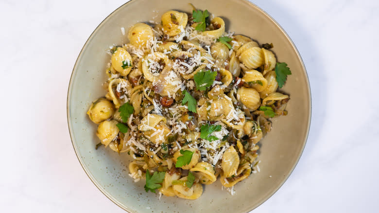 orecchiette pasta with parmesan and parsley in bowl